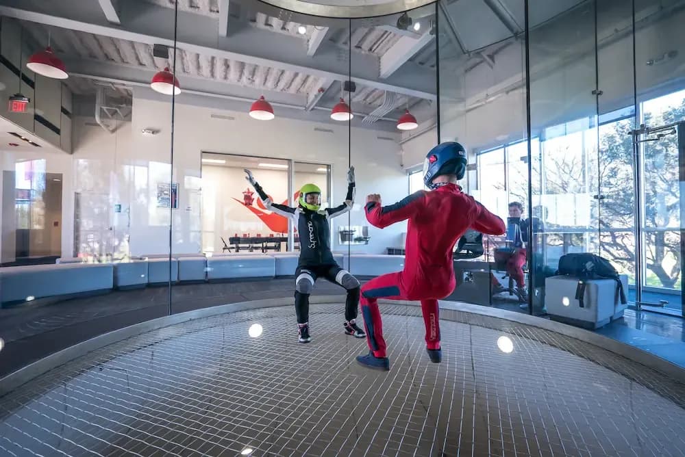 instructor and flyer in wind tunnel