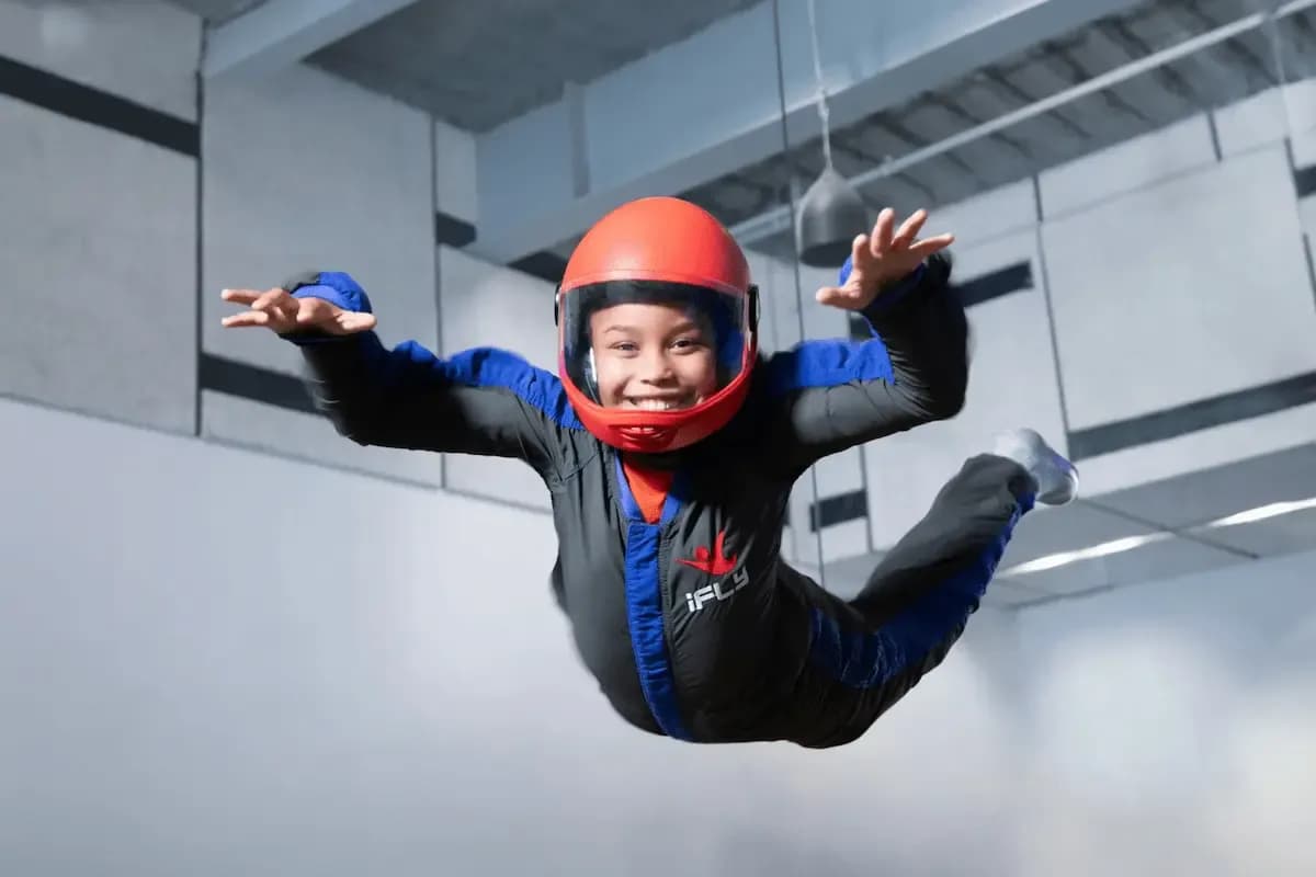 boy flying in tunnel