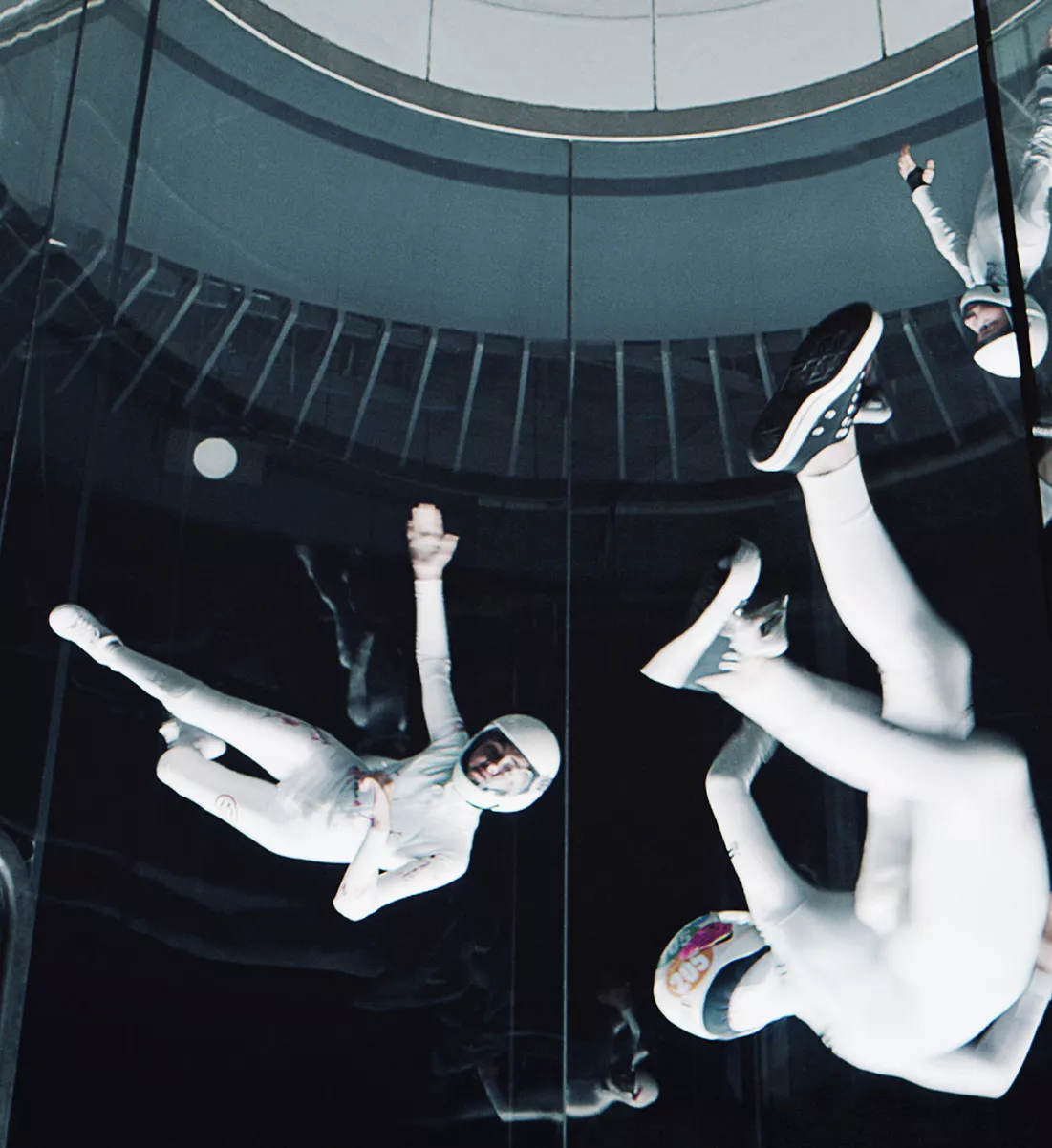 Professional skydivers in tunnel performing