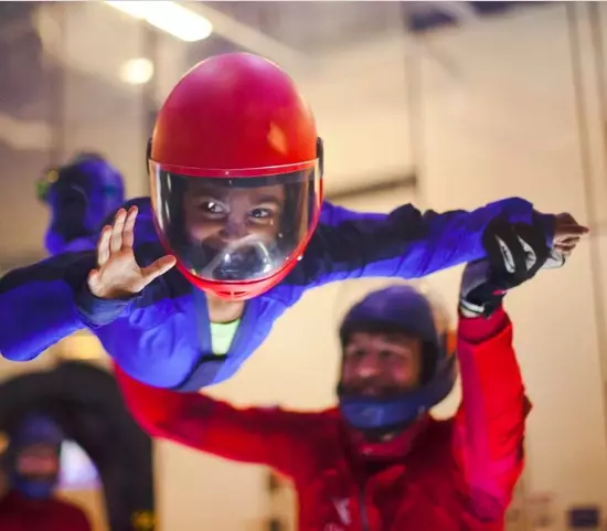 happy child being taught in the flying tunnel