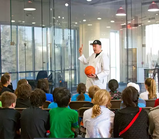 an iFly educator teaching a lecture to a group of students